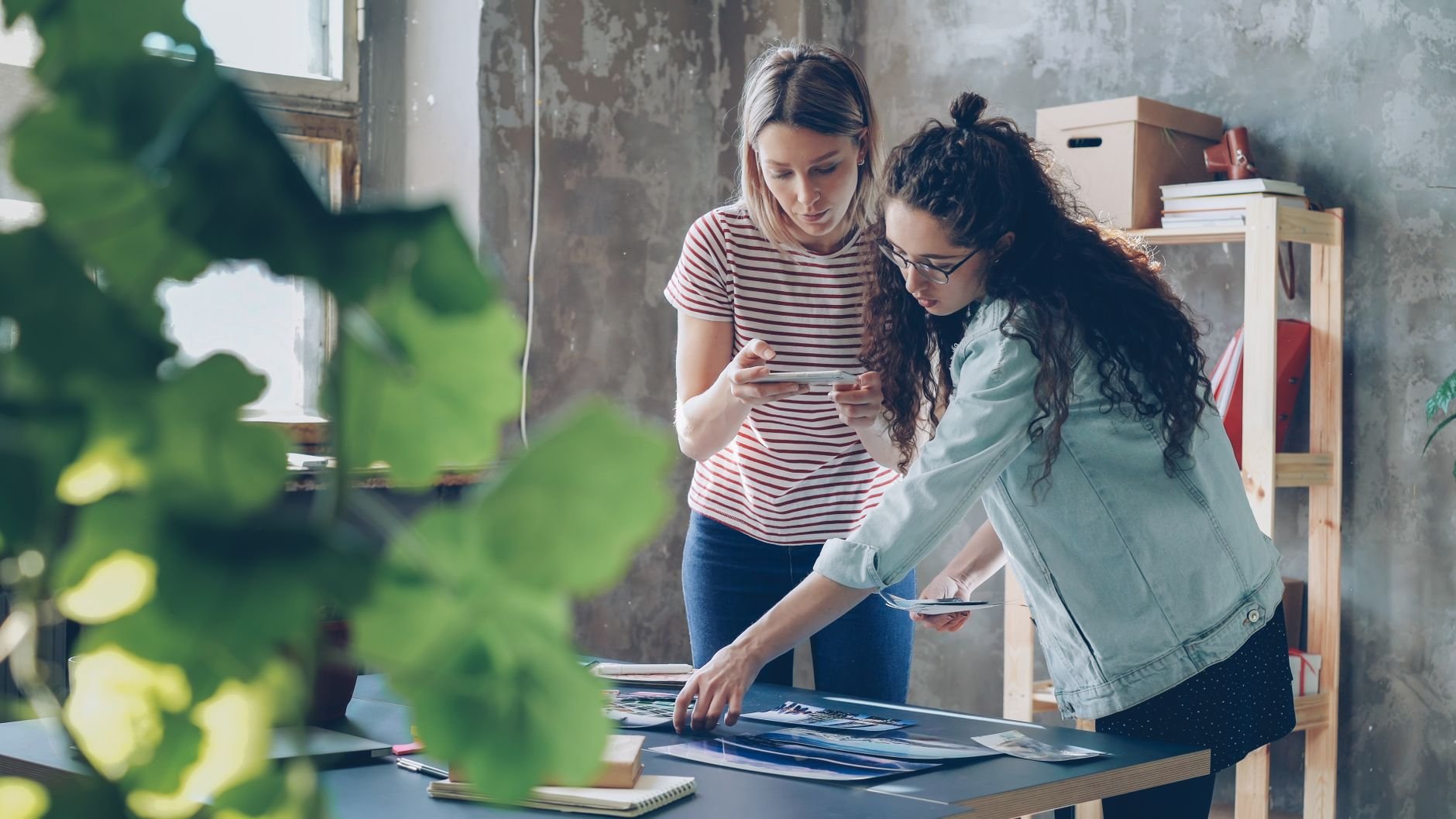 Two designers collaborating at a studio workspace